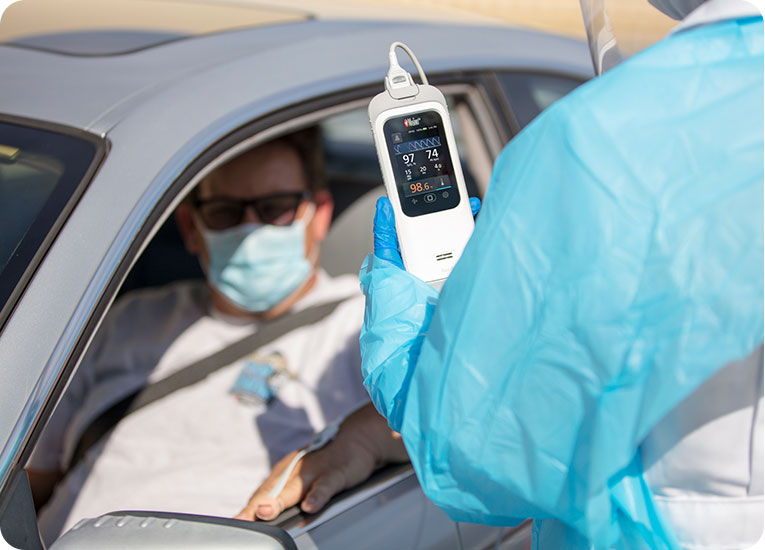 Masimo - Man in car with mask being tested inside of vehicle